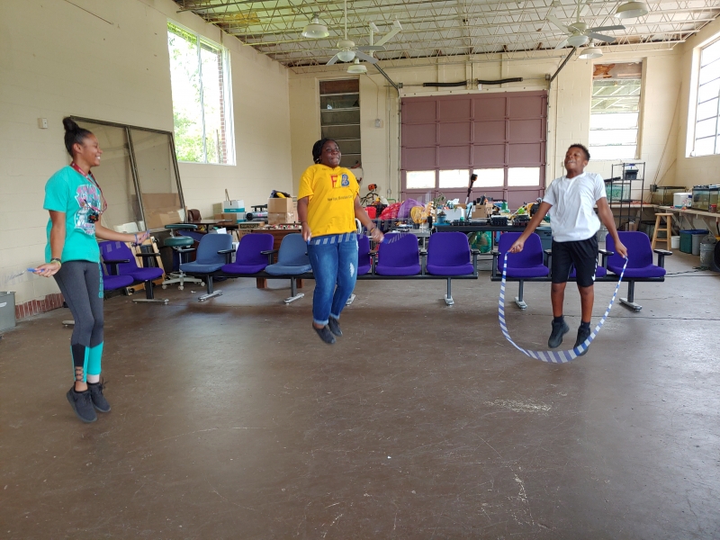 Youth playing jump rope in the gym